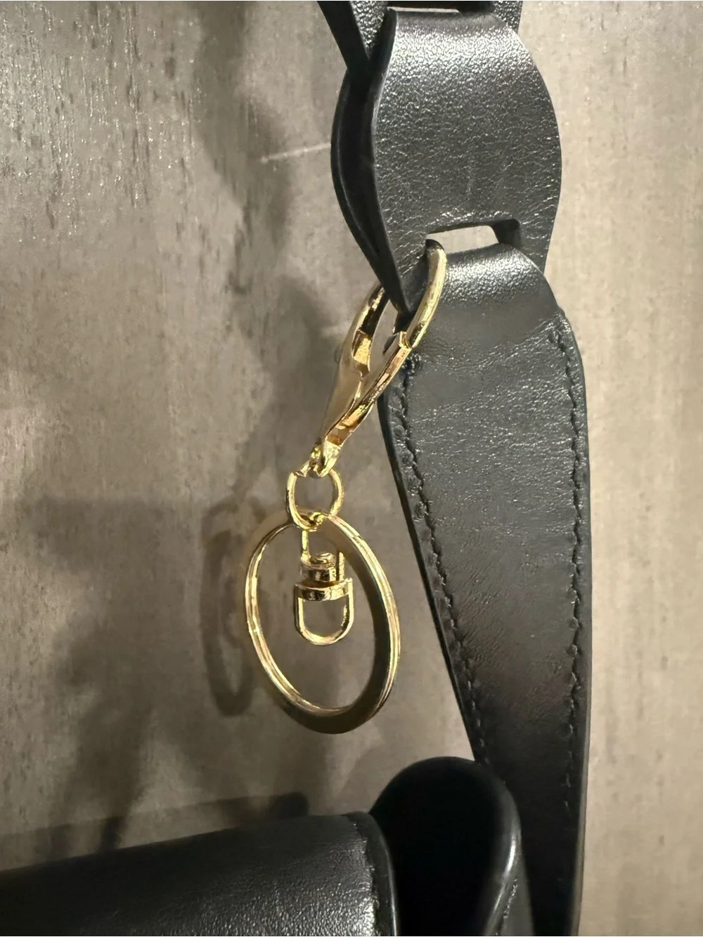 ⁠MICHAEL KORS Jolene black leather saddle bag with interlocking woven strap